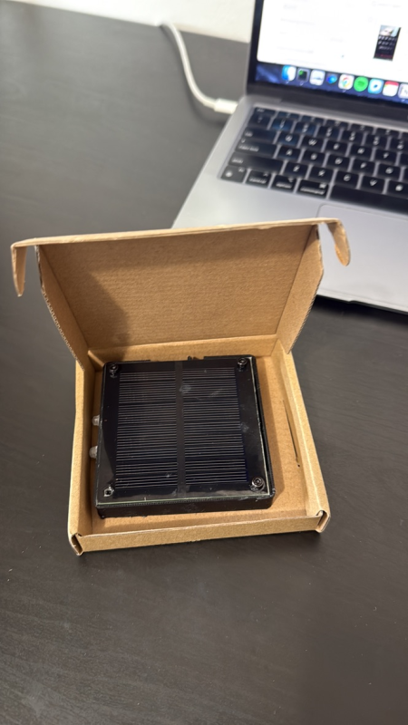 A finished light in a shipping box