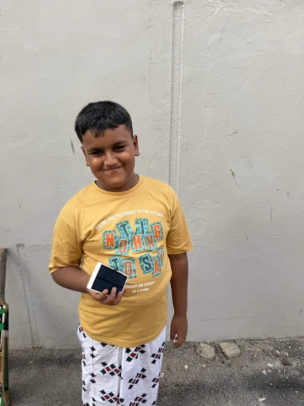A child with the solar flashlight donated to him